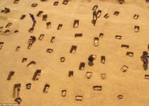 Haunting pictures show a mass grave of 113 ancient human remains buried in clay pots in China