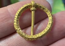 Thrilled Detectorist Finds 800-Year-Old Brooch with Magical Words to Ward off Illness