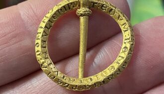 Thrilled Detectorist Finds 800-Year-Old Brooch with Magical Words to Ward off Illness