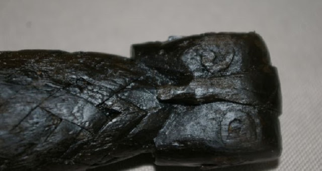 owl's head carved on the handle