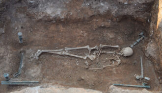 Skeleton of Ancient Woman Lying on Her Bronze Bed Found in Greece