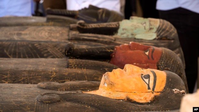 Painted coffins with well-preserved mummies inside, dating back to the Late Period of ancient Egypt around 500 B.C, are displayed during a press conference at a makeshift exhibit at the feet of the Step Pyramid of Djoser in Saqqara, near Cairo, Egypt, May