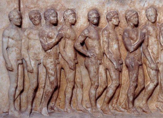 The marble slab lists the names of 31 men who went through military training together.